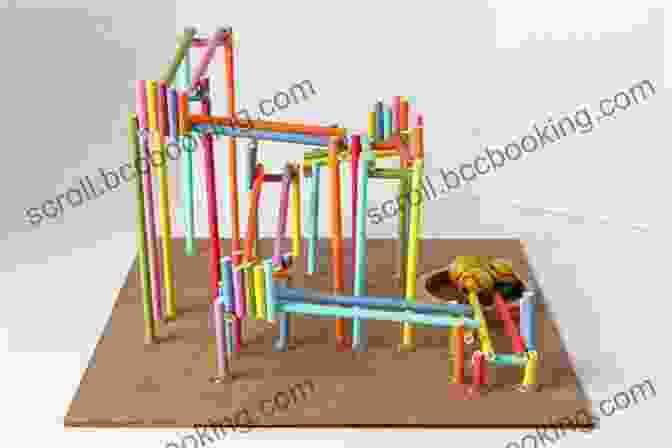 A Child Building A Marble Roller Coaster From Cardboard And Straws Build Your Own Chain Reaction Machines: How To Make Crazy Contraptions Using Everyday Stuff Creative Kid Powered Projects