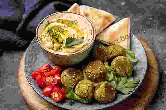 A Colorful Spread Of Mediterranean Dishes, Featuring Grilled Vegetables, Hummus, Olives, And Falafel The Forest Feast Mediterranean: Simple Vegetarian Recipes Inspired By My Travels