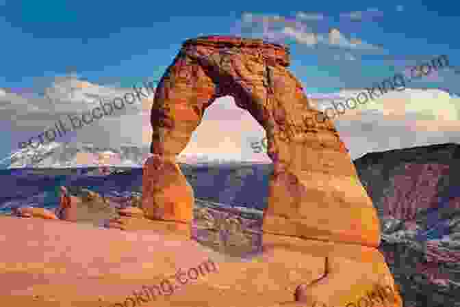 A Stunning View Of Delicate Arch In Arches National Park, Framed By A Dramatic Red Rock Landscape A Complete Guide To The Grand Circle National Parks: Covering Zion Bryce Capitol Reef Arches Canyonlands Mesa Verde And Grand Canyon National Parks