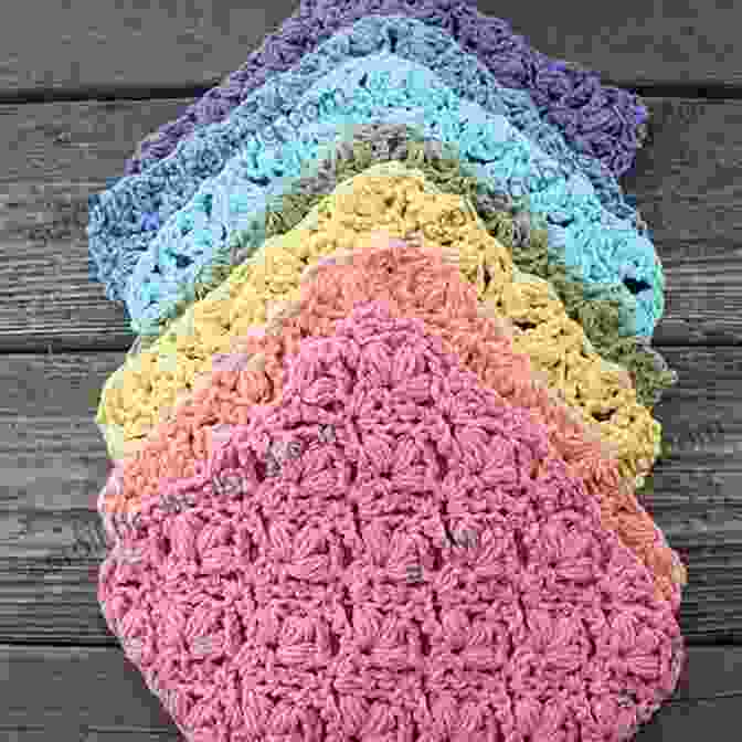 A Vibrant Collection Of Crocheted Dishcloths In Various Shapes And Colors, Showcasing Intricate Patterns And Textures. Dishcloths In The Round Leisure Arts